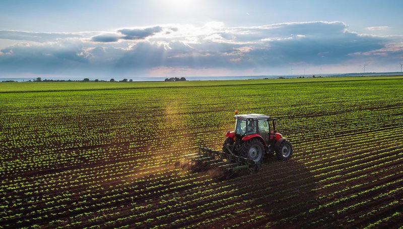 csm_tractor_cultivating_field_at_spring_53d2940097